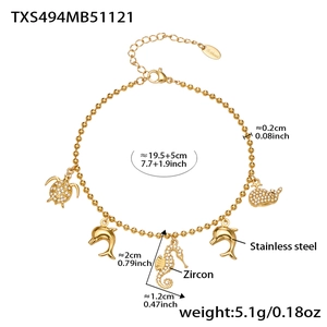 Detail showing 18k gold plated stainless steel bracelet with zircon sea creature charms