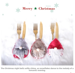 Close-up of Gnome Christmas cutlery holders in grey, brown and red on white fur