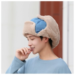 Detailed view of the thick faux rabbit fur lining and blue fabric on the trapper hat