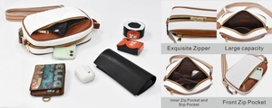 Detailed view of color-block crossbody bag featuring wide strap and large storage capacity