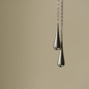 Cyberpunk large polished teardrop tassel earrings in silver-tone stainless steel finish