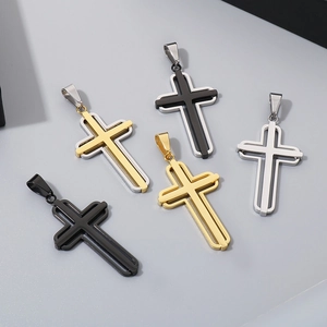 Detailed view of hollow layered cross pendants in gold, silver, and black stainless steel