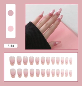 Detail of 24pcs pink coffin press-on nails featuring sweet 3D heart gradient design