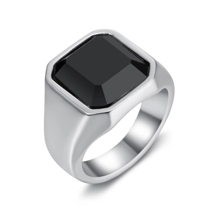 Minimalist men's ring with square black gemstone and silver band on white background