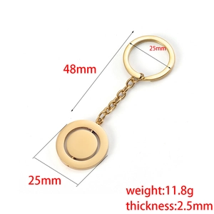 Golden rotatable round stainless steel keychain with detailed product dimensions and weight
