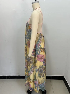 Side view of backless floral maxi dress with yellow paisley print and thin straps