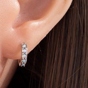 Exquisite silver huggie earrings with five round opals showing colorful blue-green fire