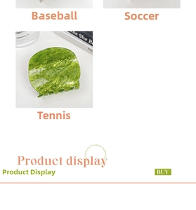 Detailed view of tennis ball style green acetate hair claw clip with smooth acrylic teeth