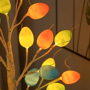 Close-up of Easter egg tree lamp with colorful floral patterns and warm LED glow