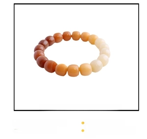 Macro detail of natural Bodhi seed bracelet with gradient brown to cream beads