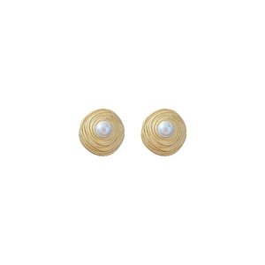 Vintage style gold spiral earrings with white pearl center on a white background