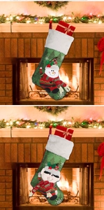 Green Christmas stockings with snowman and elf appliques hanging by a festive fireplace