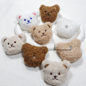 Detailed view of plush bear charms with back opening design for DIY crafts and accessories