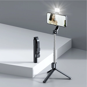 Macro detail of foldable selfie stick tripod with integrated LED fill light and remote