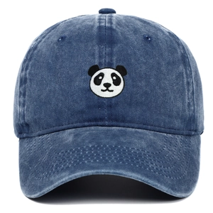 Close-up of a panda face embroidery on a blue washed denim baseball cap