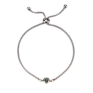 Minimalist silver stainless steel birthstone bracelet with a green zircon and slider clasp