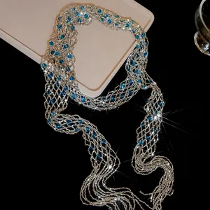 Elegant crystal beaded tassel scarf necklace with sparkling blue accents on black surface