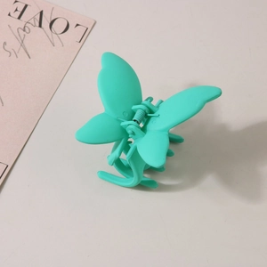 Matte mint green butterfly hair claw clip for women with elegant frosted finish
