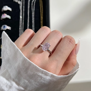 Close-up of S925 sterling silver ring featuring a large oval pink ice flower cut gemstone