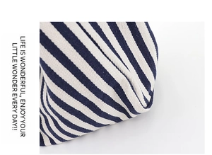 Close-up of high-density blue and white striped canvas fabric with detailed weaving texture