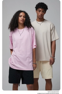 Oversize cotton t-shirt and shorts set shown in pink and beige on male and female models