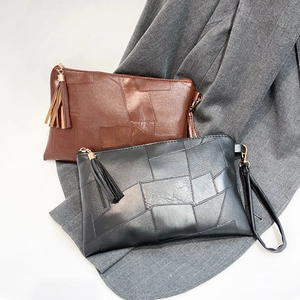 Retro leopard print patchwork clutches in brown and black with fringe zip and wrist strap