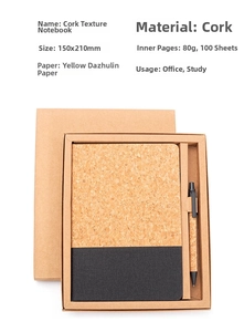 Detailed view of the cork and black fabric notebook with matching pen in gift box