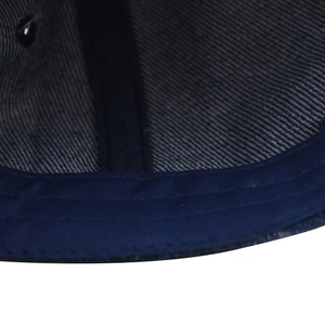 Detailed macro view of internal stitching and twill fabric on New York baseball cap