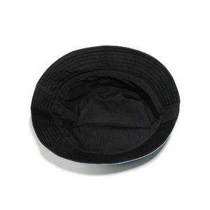 Detailed view of blue denim bucket hat with floral print and black inner lining