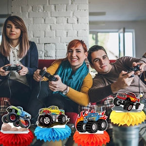 Monster truck honeycomb centerpieces in red and blue for a themed birthday party decor