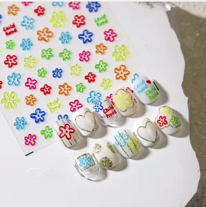Macro detail of colorful floral 3D nail stickers with Child hood text design