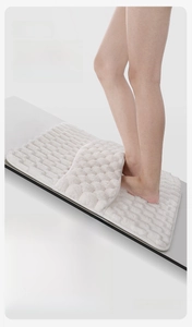 Detailed view of white bubble texture memory foam bath mat showing superior anti-slip grip