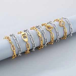 Detail of 10mm industrial metal bracelets with skull charms and OT buckles on display