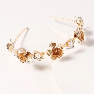Elegant gold flower headband with pearls and metallic leaf textures for wedding styles