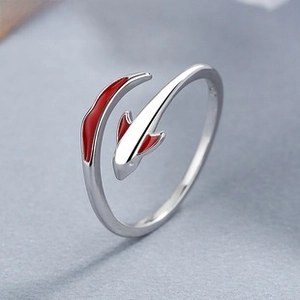 Macro detail of 925 sterling silver koi fish ring with vibrant red enamel accents