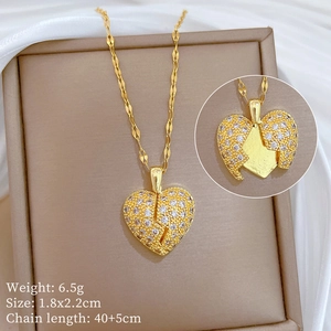 Macro shot of opening gold heart pendant with cubic zirconia on a wavy water chain