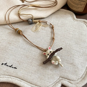 Cute white cat on branch pendant necklace with wooden beads and woven wax cord rope