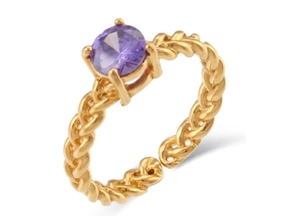 Detail of twisted gold ring band featuring a round purple zircon set in four prongs