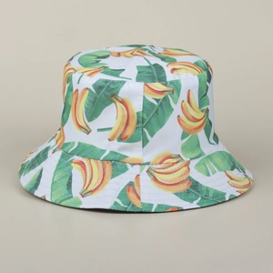 Detailed close-up of summer banana print fabric on a reversible bucket sun hat