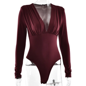 Detail of deep red V-neck bodysuit showing pleated texture and slim fit long sleeves
