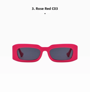 Detail view of bold rose red rectangular sunglasses with thick frames and dark lenses