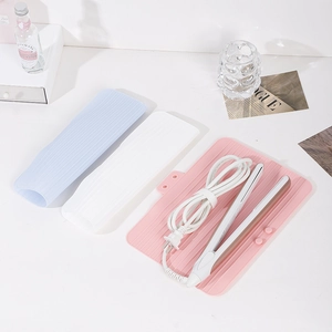 Portable silicone heat resistant mat and travel pouch for hair straightener styling tools