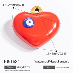 Macro view of a red heart-shaped evil eye pendant with exact size measurements