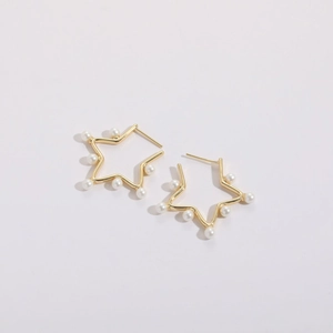Gold star pearl earrings with minimalist 14k plating and symmetric pearl accents