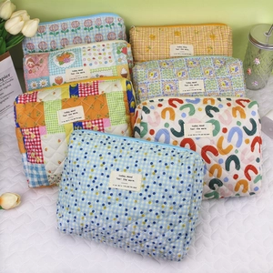 Quilted cotton makeup and stationery pouch with floral and plaid prints in a soft aesthetic