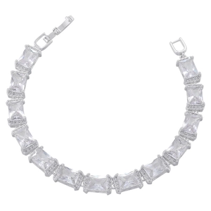 Macro shot of silver hip-hop bracelet with rectangular zircon stones and luxury metal clasp