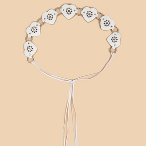Detail of white PU leather heart belt with hollow star patterns and metal ring links