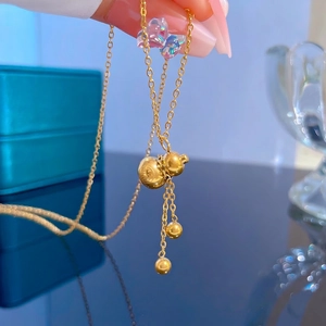 Golden titanium steel gourd necklace featuring a Fu character engraving and tassel pendants