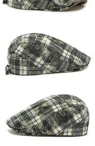 Macro view of washed cotton plaid beret with distressed texture and vintage pattern