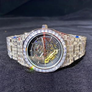 Detailed close-up of diamond-encrusted skeleton mechanical watch with luminous hands